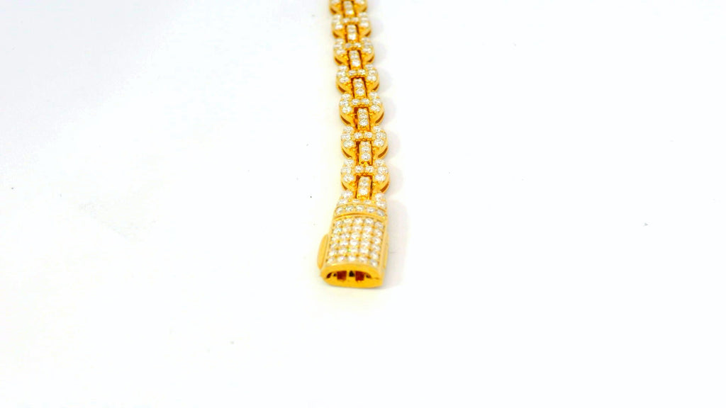 Silver base- gold gucci link bracelet with lab stones .