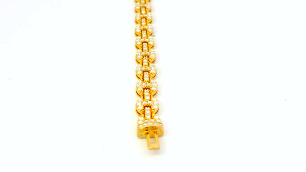 Silver base- gold gucci link bracelet with lab stones .